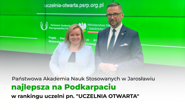 Grafika przedstawia JM Rektor, dr Beatę Rejman odbierającą nagrodę od Ministra Nauki i Szkolnictwa Wyższego.